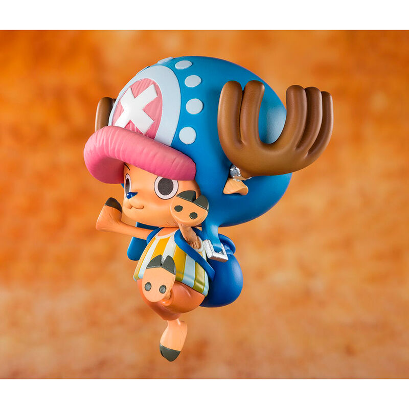 Colorful figurine of a character with a blue hat and orange body on an orange background
