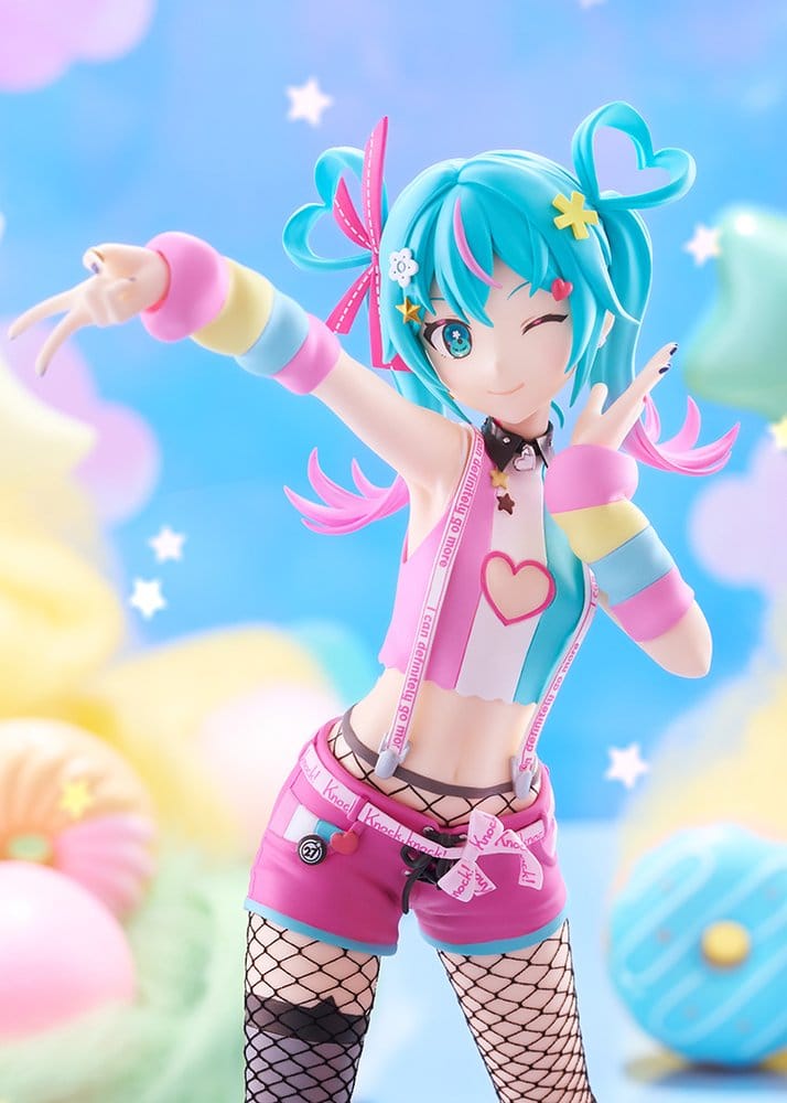 A colorful anime-style figurine of a winking character with bright turquoise hair, pink and pastel striped accessories, a pink heart vest, pink shorts, and fishnet stockings, posed against a soft pastel background with stars and abstract shapes.
