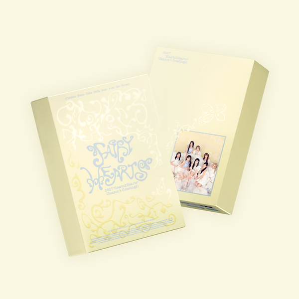 Yellow Seasons Greetings box with blue writing on a white background