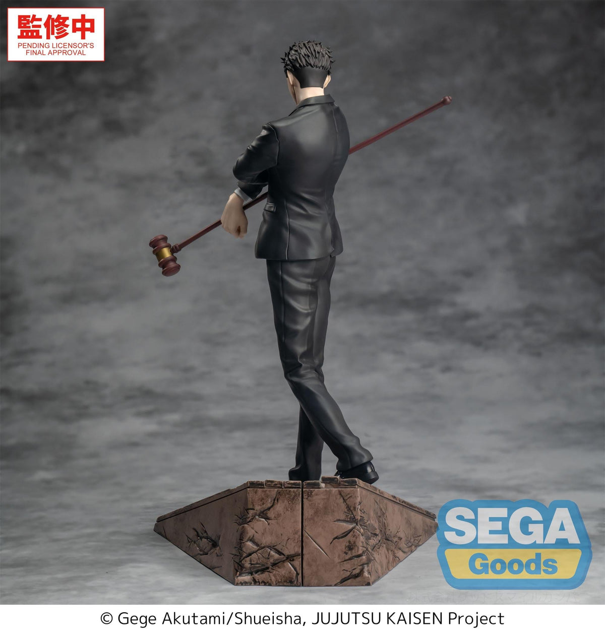 Statue of a character from 'Jujutsu Kaisen' holding a gavel on a gray background with Sega Goods branding.