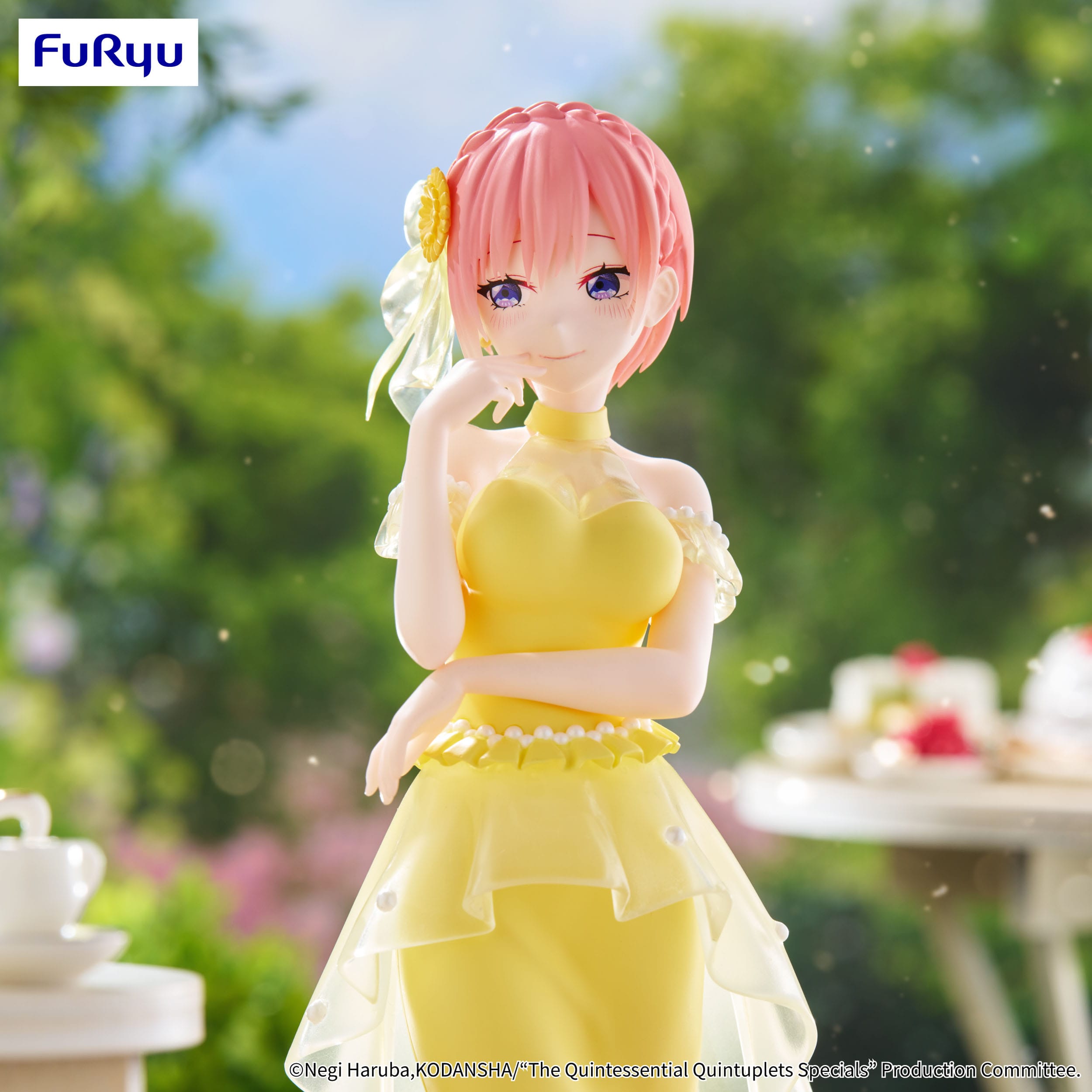 Anime character figurine in a yellow dress with pink hair, standing outdoors.
