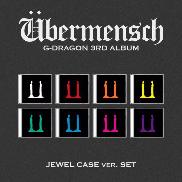 Album cover for G-Dragon's third album 'Übermensch' with colorful symbols on a black background.