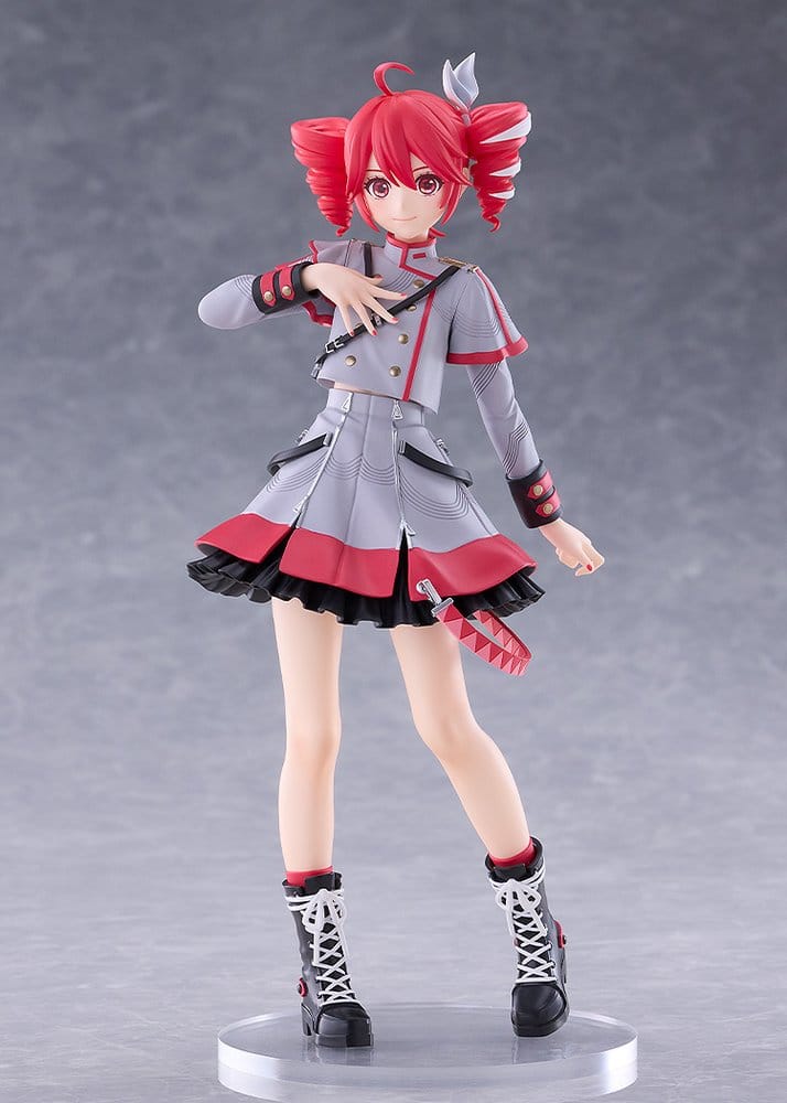 An anime figurine of a female character with pink hair, wearing a gray and red school uniform with black accents, standing on a clear round base against a gray studio background.