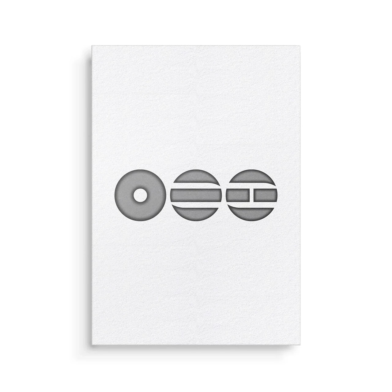 White card with black geometric design on a white background