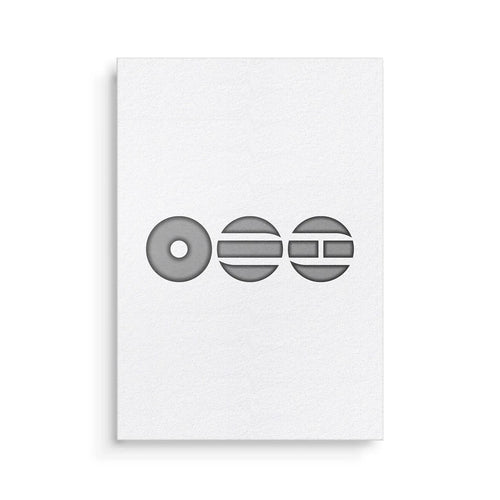 White card with black geometric design on a white background