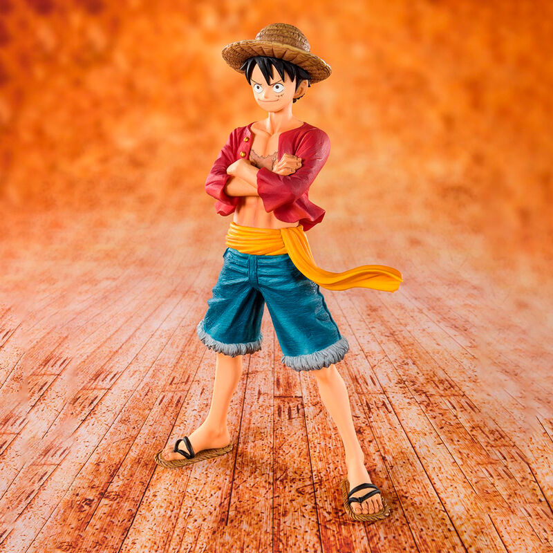 Figurine of a character with a straw hat on an orange background