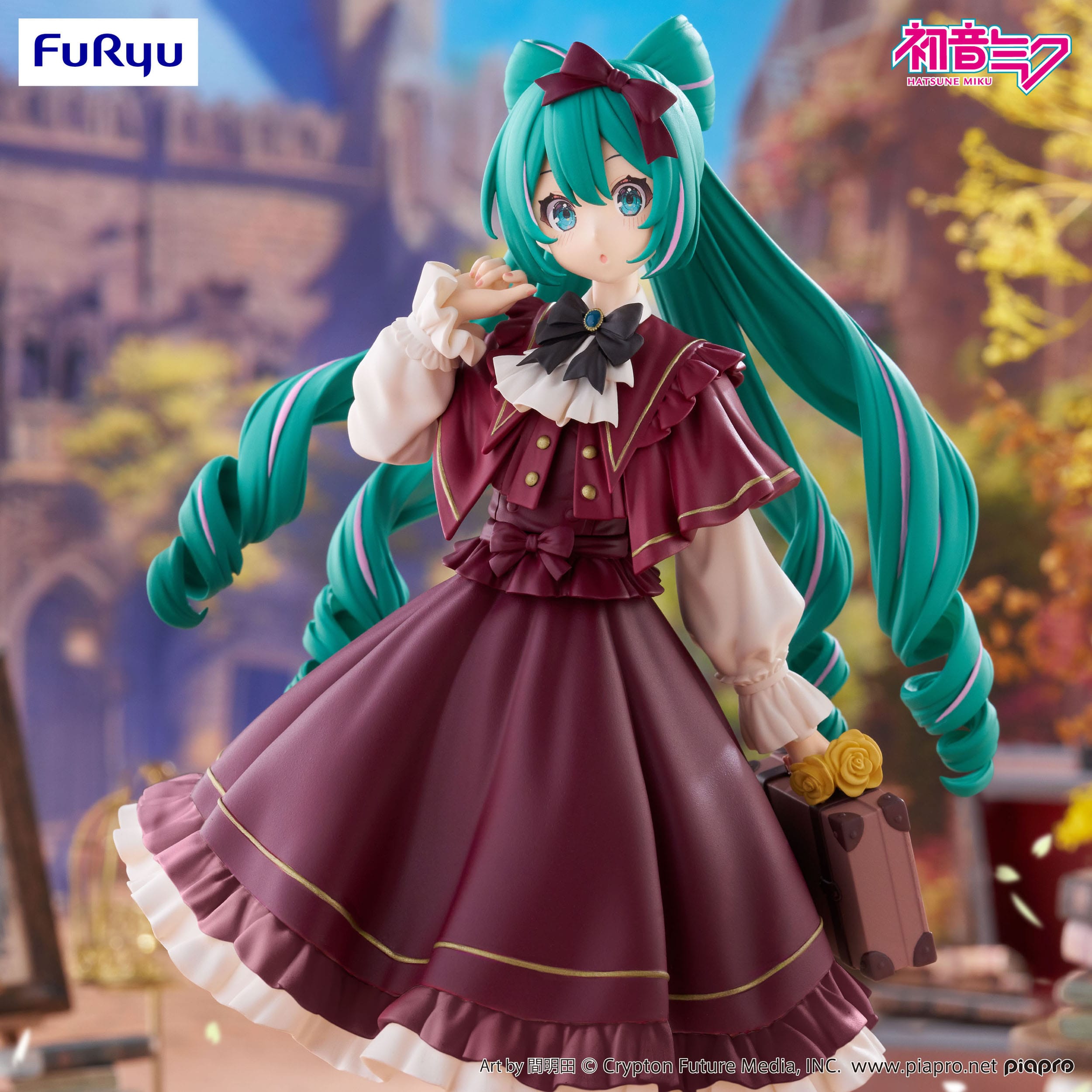 Figurine of a character with green hair and a red dress in a decorative setting
