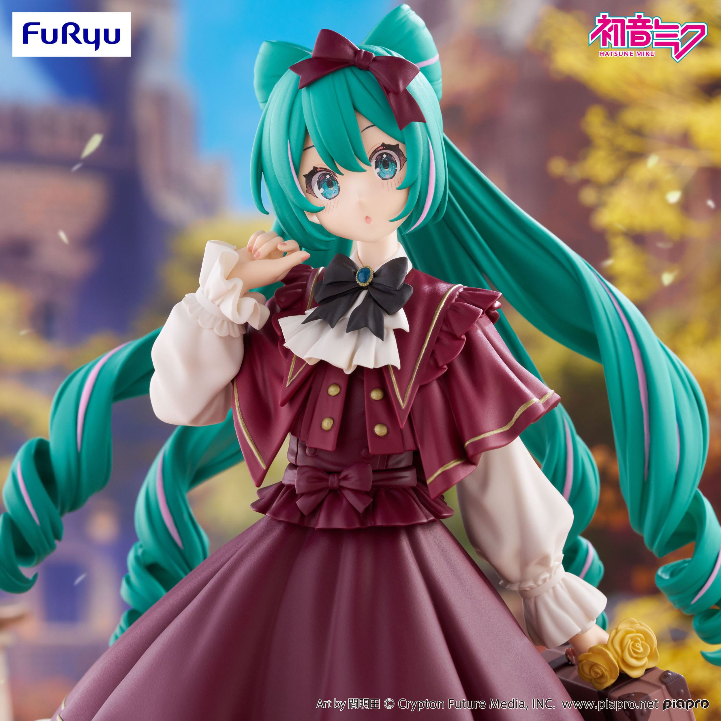 Figurine of a character with green hair and a red outfit, standing in a scenic background.