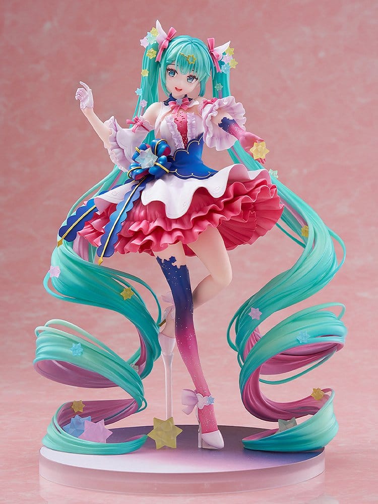 Colorful anime figurine with vibrant hair and outfit on a pink background