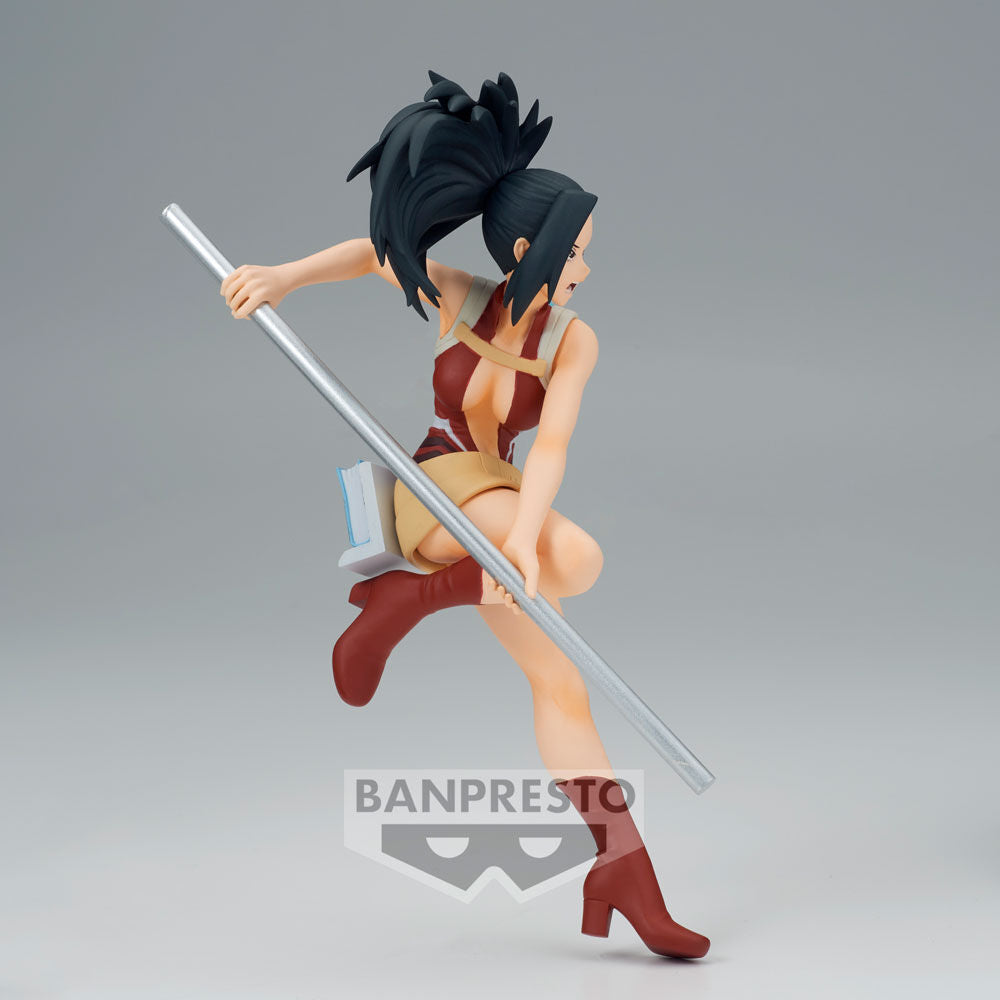 Action figure of a character from 'One Piece' with a gray background, featuring the Banpresto logo.