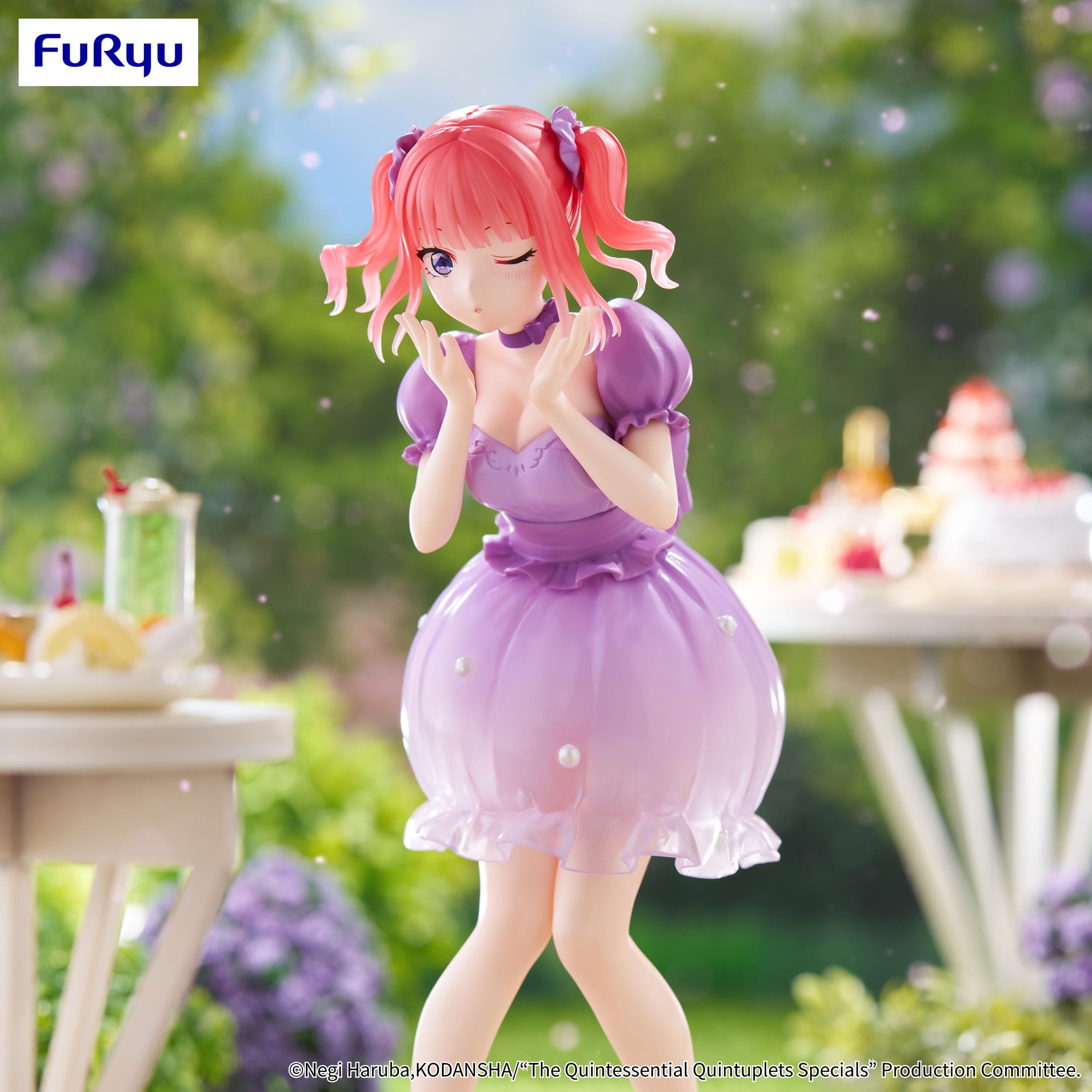 Figurine of a character in a purple dress with pink hair, standing outdoors with blurred background