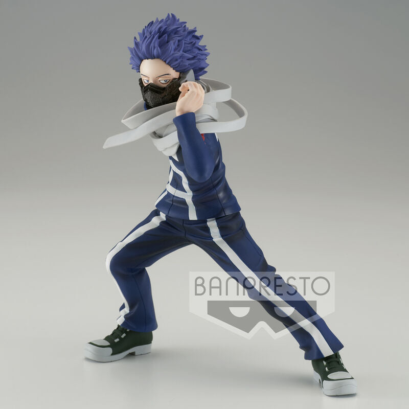 Action figure of a character in blue and white outfit with a gray background