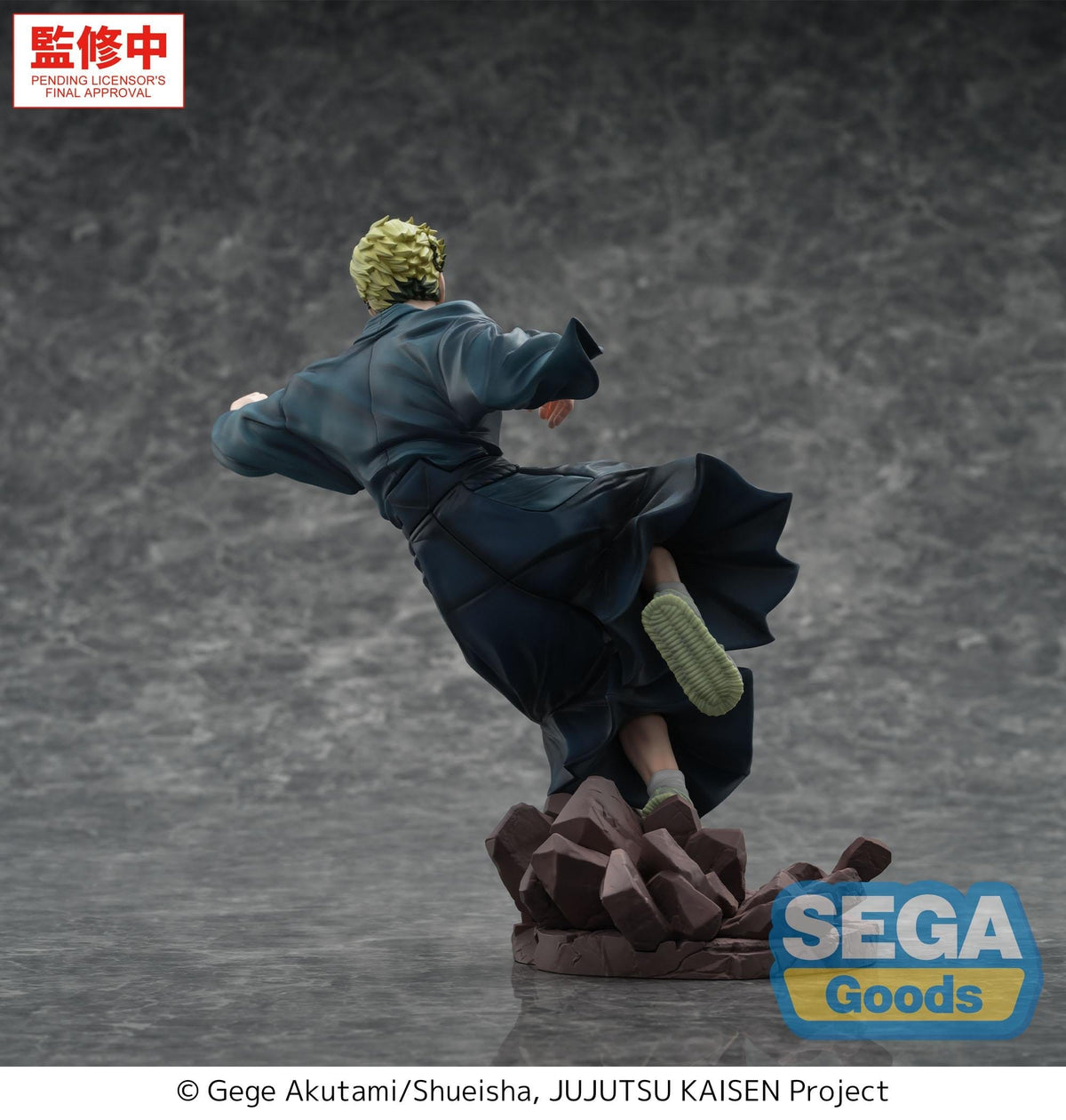 A collectible action figure of a character from Jujutsu Kaisen in a dynamic kicking pose, standing on a cracked stone base. The figure is wearing a dark blue robe and has light green hair and sole.