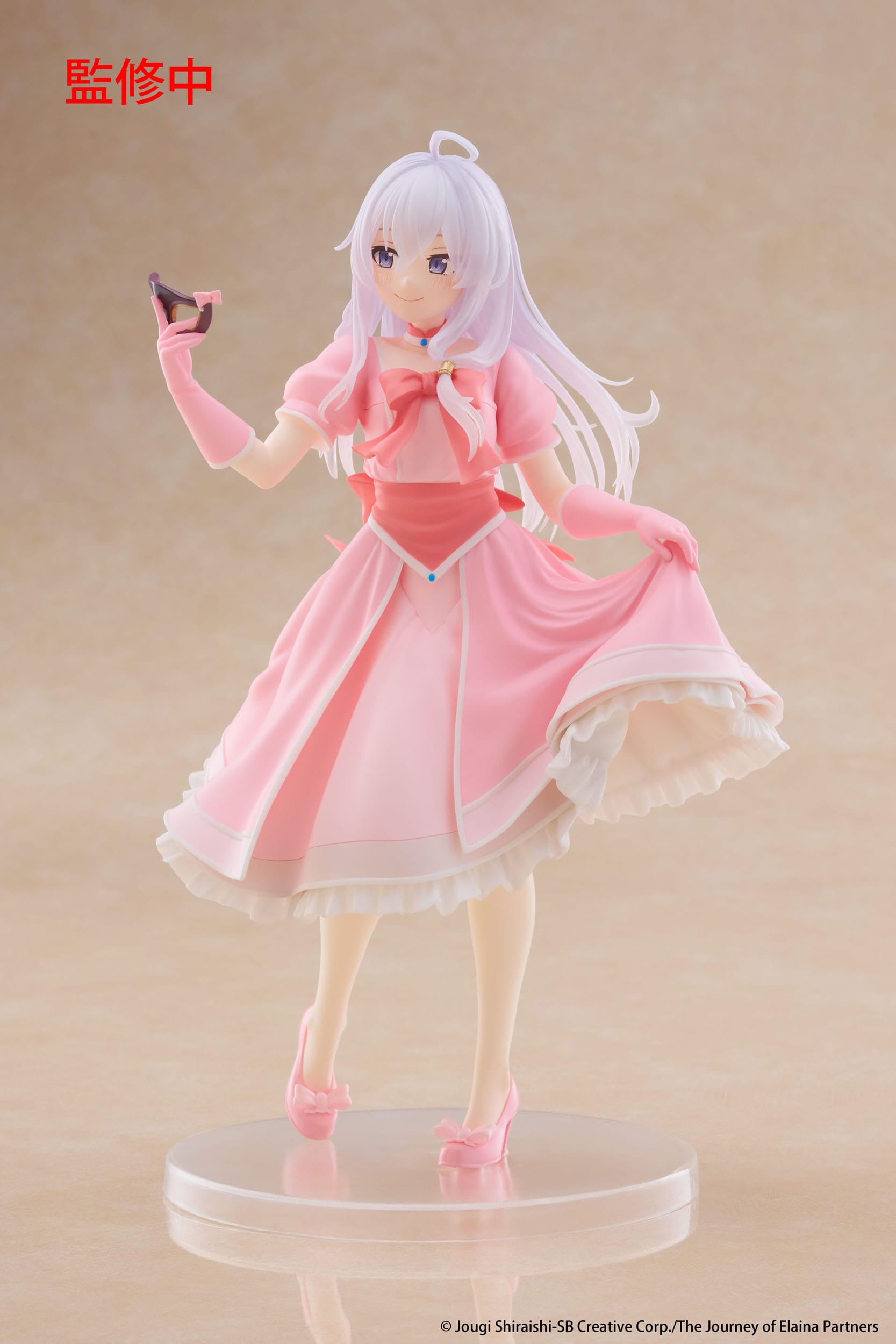 Figure of a character in a pink dress on a beige background