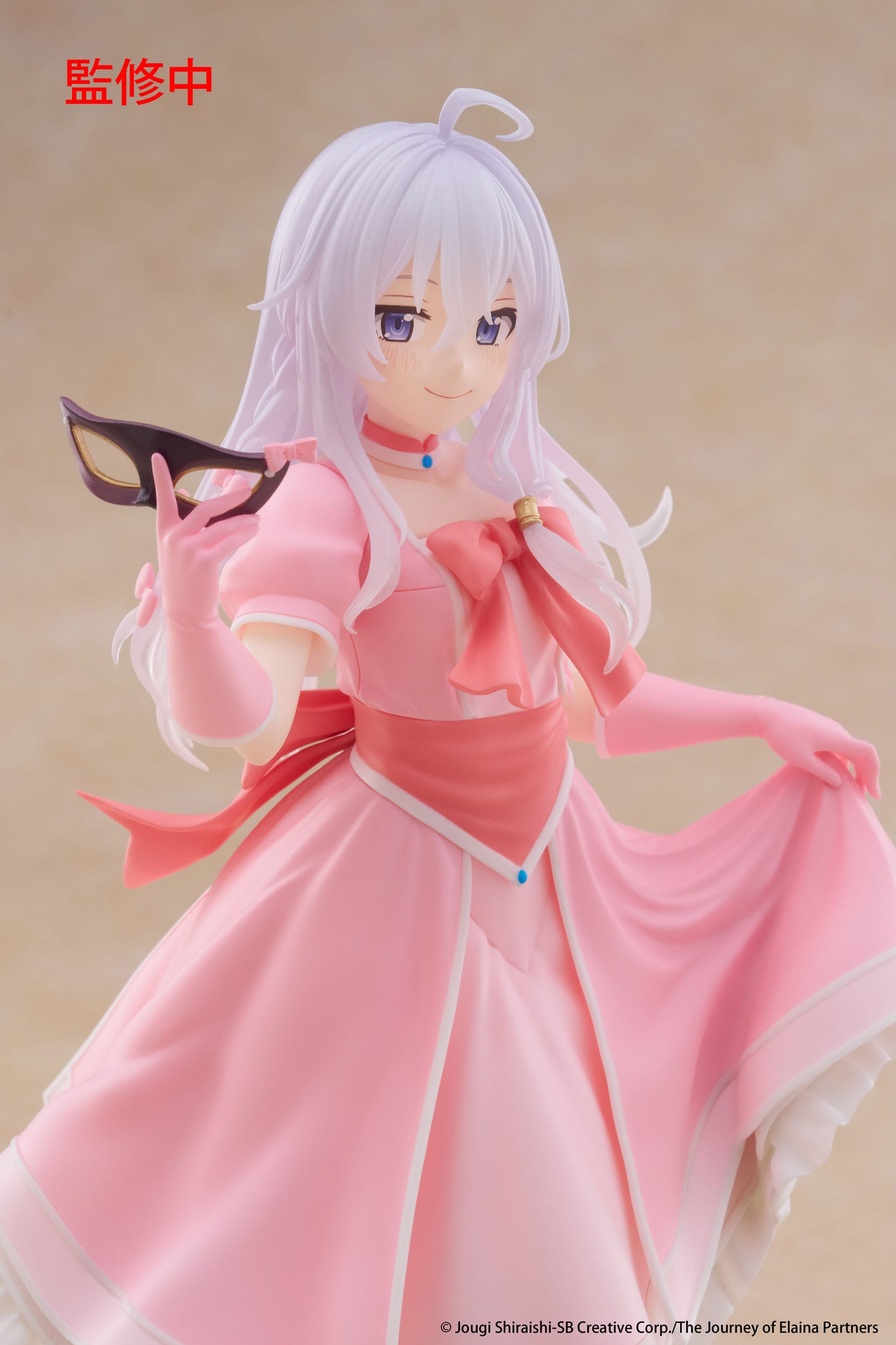 Figure of a character in a pink dress with white hair against a beige background