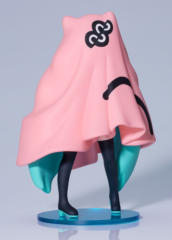 Figurine with a large pink hood and teal body on a gray background
